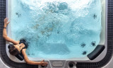 girl-spa-hot-tub-seen-from-with-bubbling-water-overhead-view-1-1407544